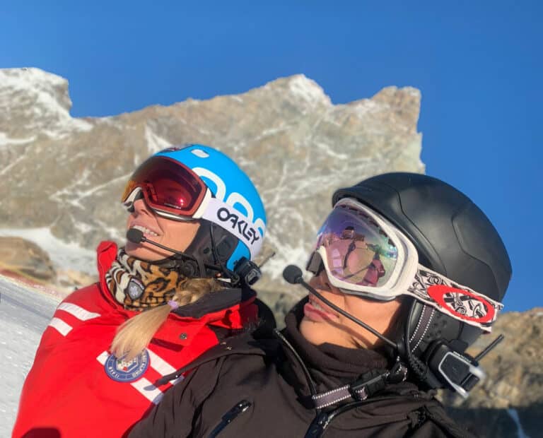 Ski instructor providing technical feedback
